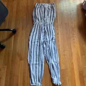 This is a strapless full-leg romper. Size large. White with blue and gold strips